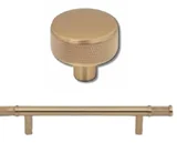 Warm metal cabinet knob and pull pictured on the kitchen board
