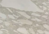 Veined stone reference from the kitchen cabinet board; final slab not specified
